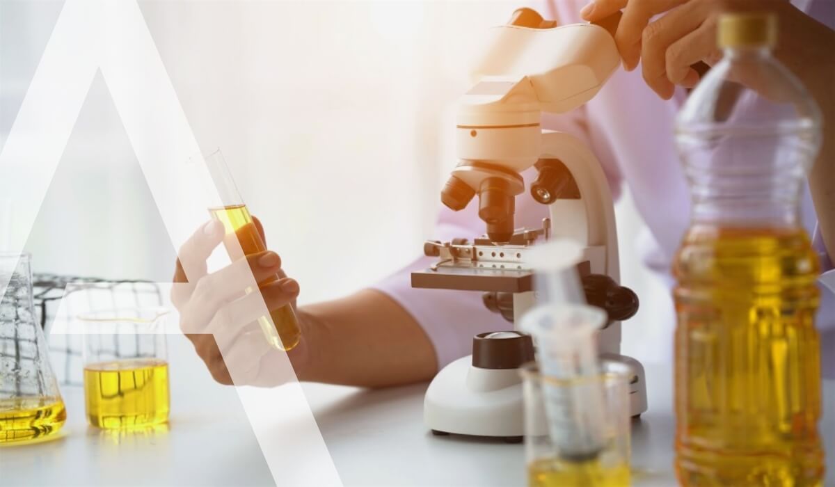 Scientist analyzing oil samples in a laboratory