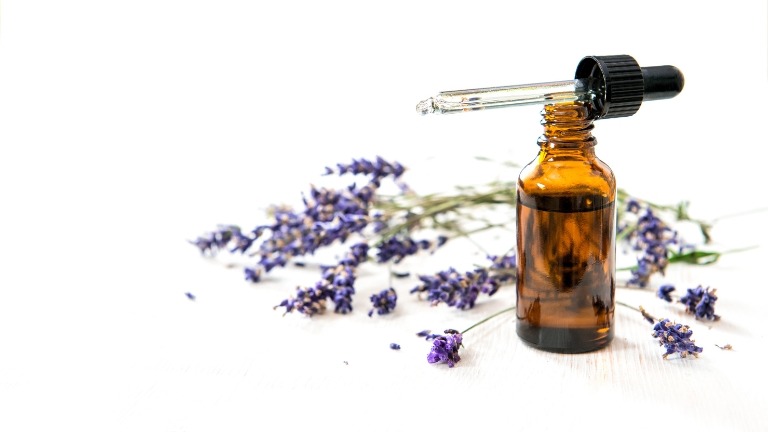 Essential oil with lavender flowers