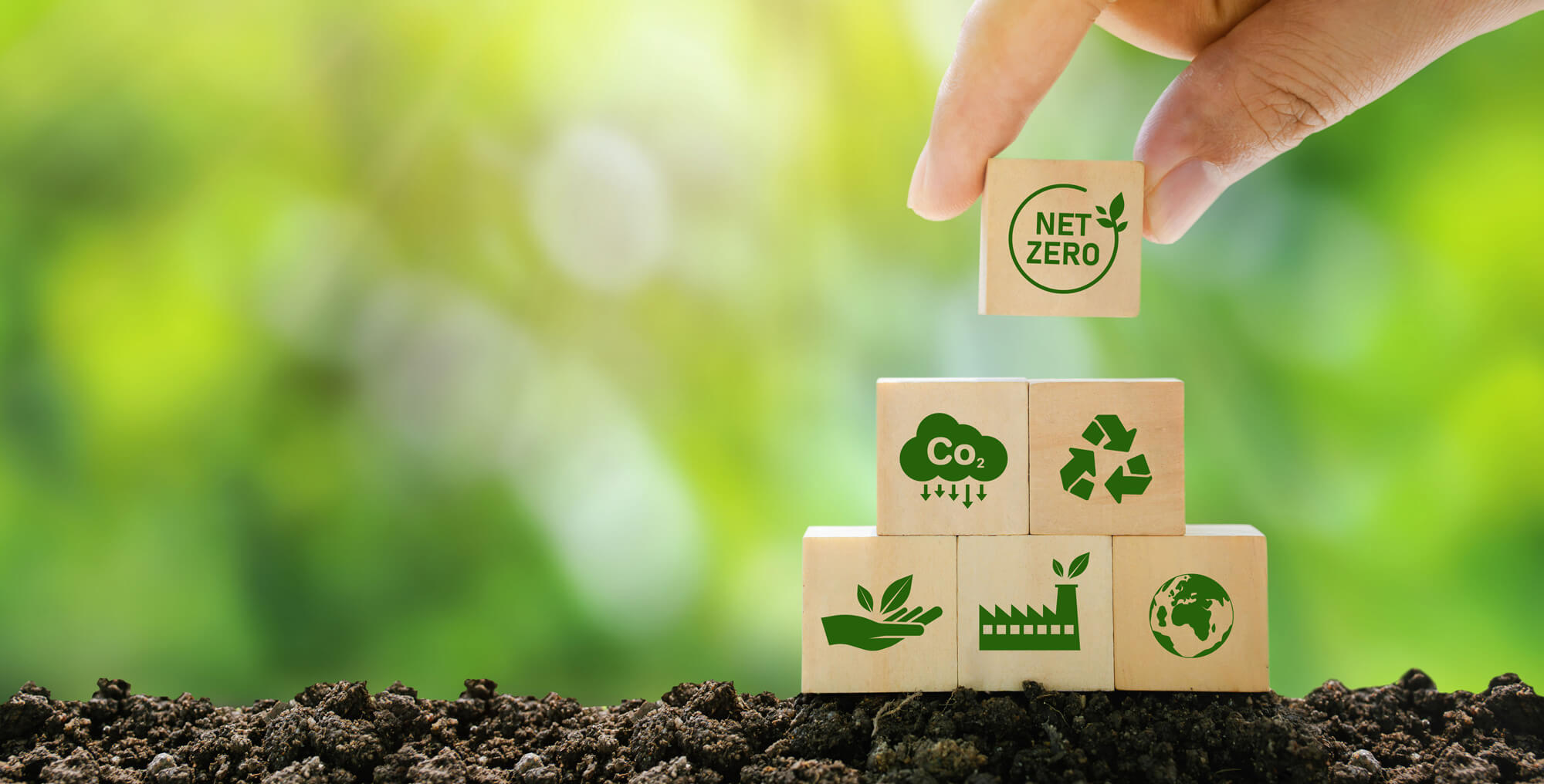 Hand-assembling blocks representing biogas, the green industry, and bio-based carbon analysis in accordance with ASTM D6866