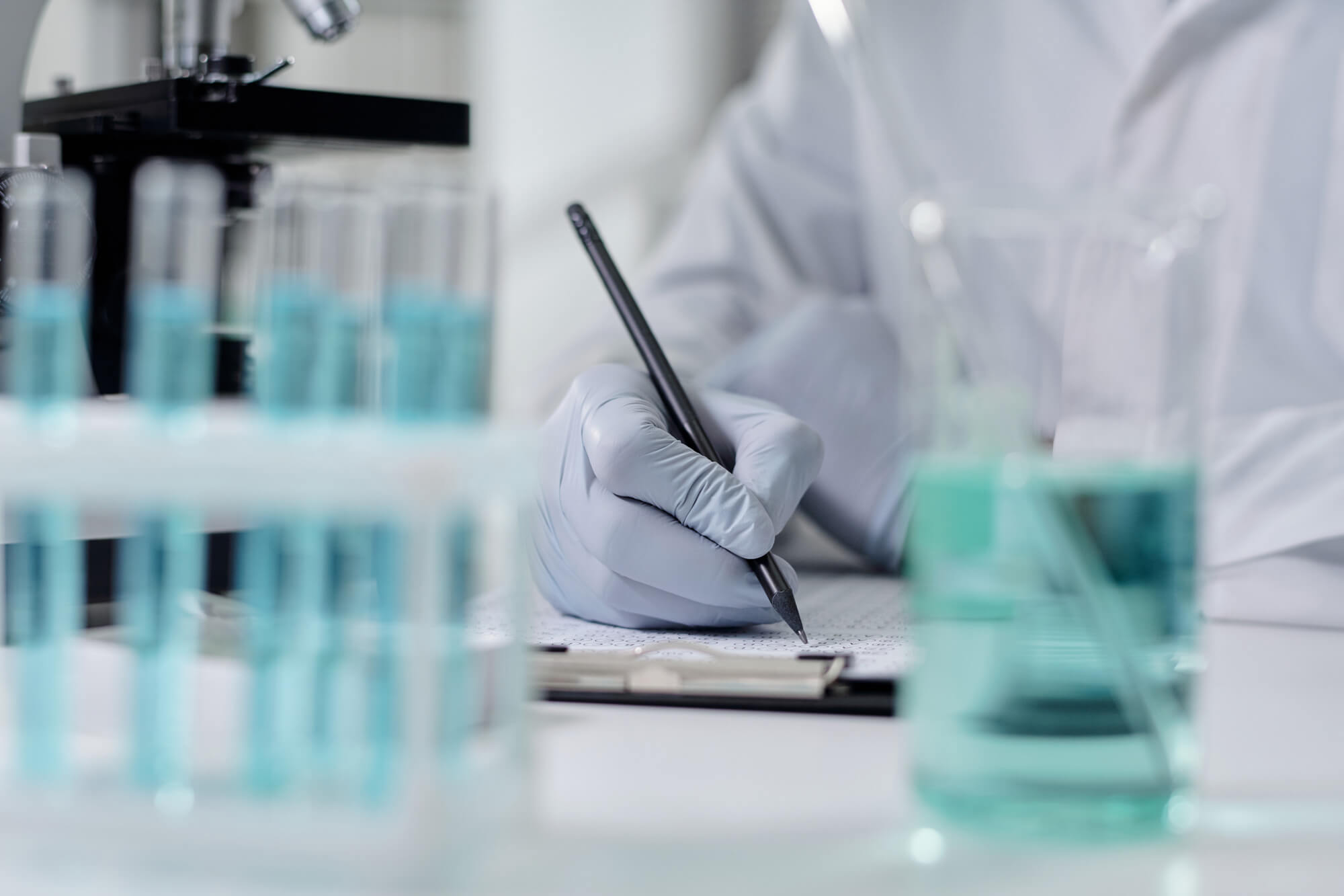 Scientist documenting analytical results in a laboratory