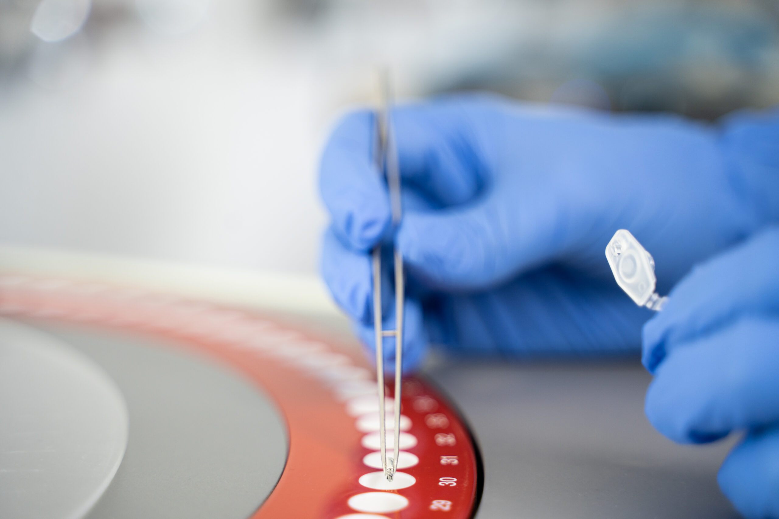 Sample being placed in a centrifuge for radiocarbon dating and carbon-14 analysis in a laboratory
